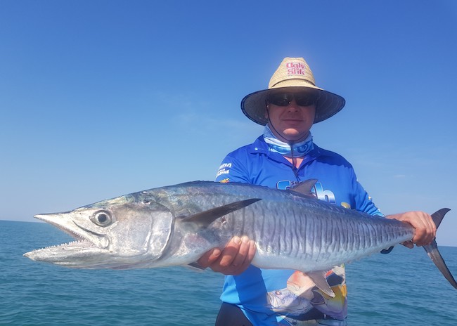 Dalton showing off his catch during the best fishing season in Cozumel.