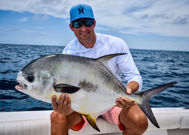 Jackson enjoying fishing on a sunny day in Cozumel.