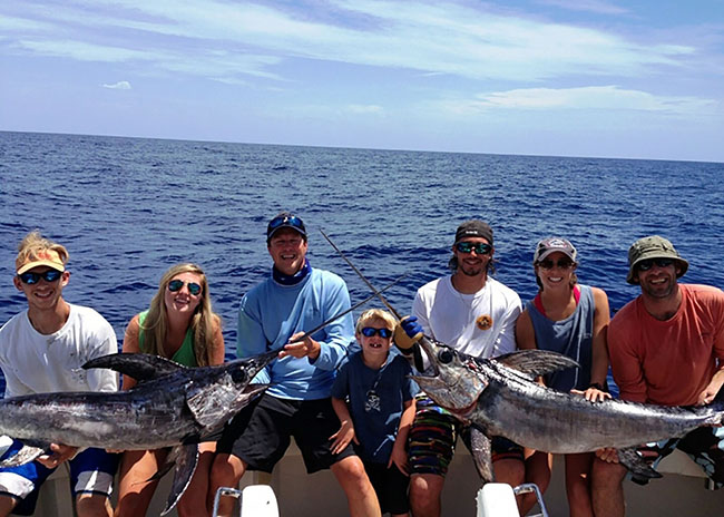 Richard and his family enjoying their catch after a great fishing charter trip.
