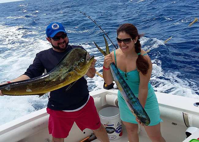 Todd and his girlfriend grabbing their catch after an abundant fishing day.